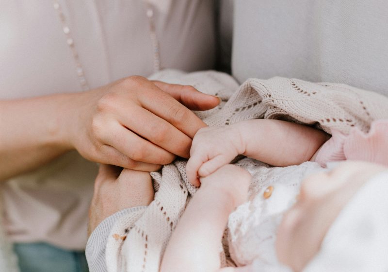 International family with newborn baby at home in Switzerland receiving postpartum support